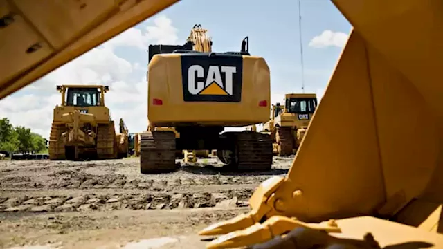 Stocks making the biggest moves premarket: Caterpillar, Chevron, Apple and others