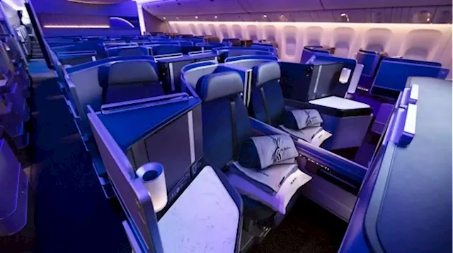 Flight turns back after economy passengers upgrade themselves to business class