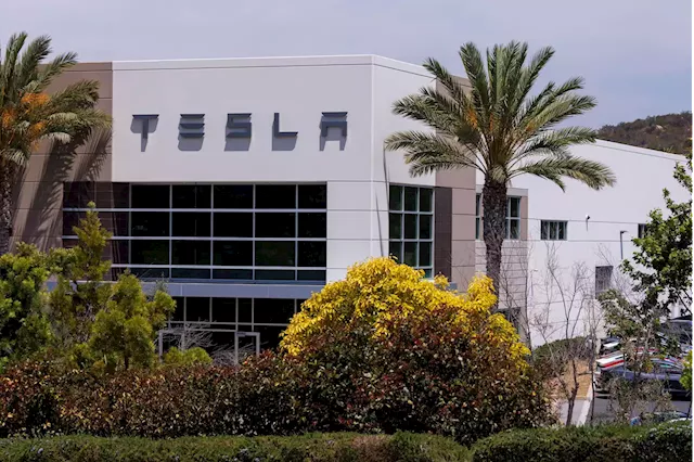 Stocks Making the Biggest Moves Midday: Tesla, Enphase Energy, Exxon Mobil and More