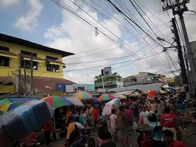 Oponganons given cashless payment or pay in cash options for tricycle fare, buying goods in market