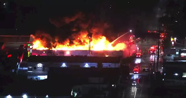 Firefighters battle 2-alarm fire burning Huntington Park business