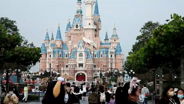 As China grapples with rare protests, Shanghai Disneyland shuts over Covid curbs once again | CNN Business