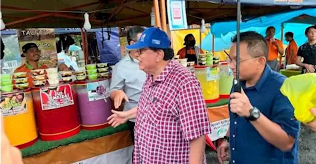 Candidates mingle with voters at Putrajaya night market