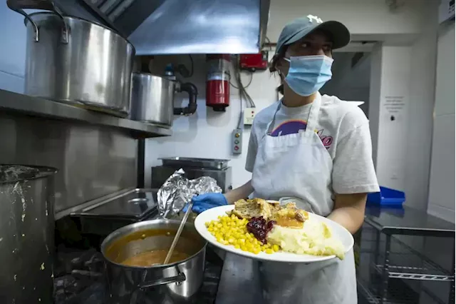 Volunteers at Kensington Market pitch in to serve Christmas meals: ‘It’s a lonely day for many people’