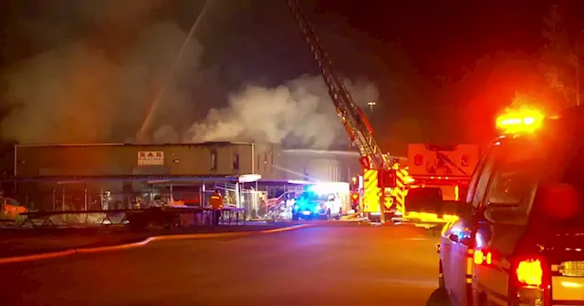 Crews investigating two alarm fire at paving company