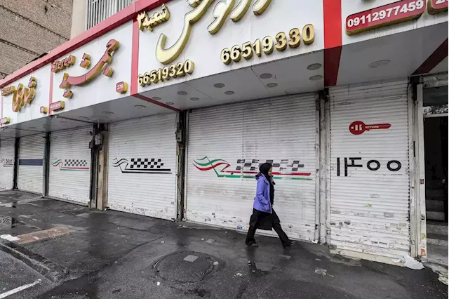 Iran protesters hold business strikes even as state warns of executions