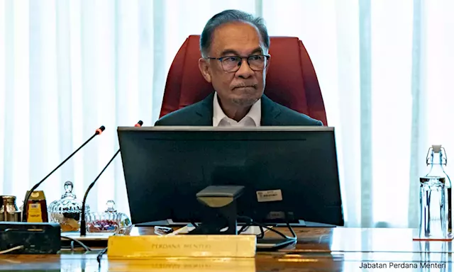 Anwar clocks in as finance minister