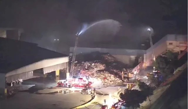 Firefighters Knock Down Four-Alarm Fire At Waste, Recycling Company In Anaheim After Two-Hour Battle