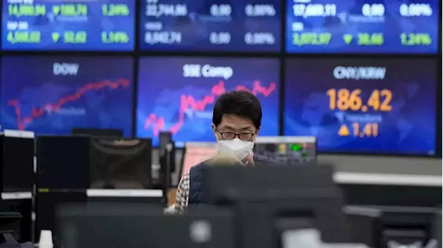 Asian shares mixed as earnings fuel gains on Wall Street