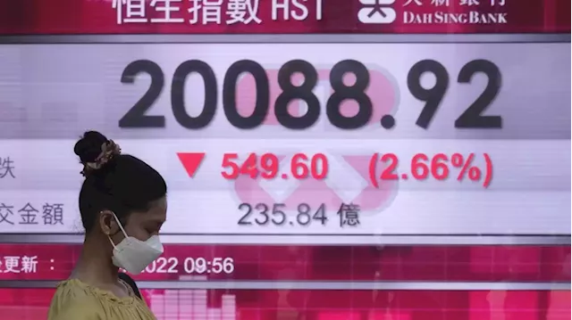 Asian shares fall amid interest rate, earnings worries