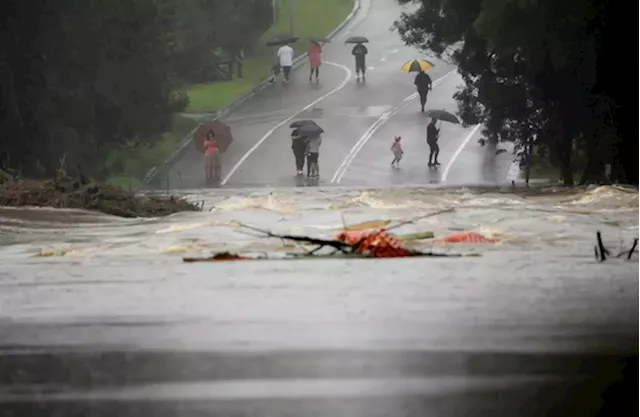 Torrential rains hit Australia as conspiracy theorists blame aviation company for floods