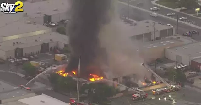 Firefighters battle blaze at towing company in Los Alamitos