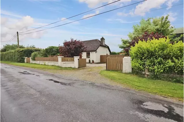 This sweet country cottage with a picket fence and private garden is on the market for €310,000 | IMAGE.ie