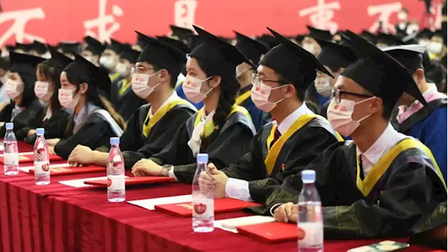 Analysis: Record numbers of Chinese graduates enter worst job market in decades