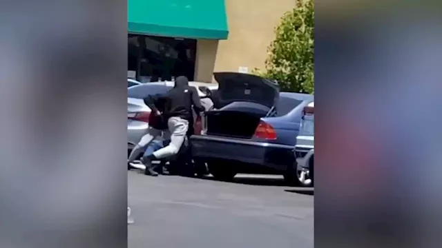 Violent robbery at Rowland Heights market caught on video; 2 suspects at large