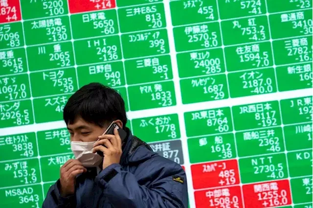 Asian stocks at lowest in two years, euro near par with dollar on growth fears