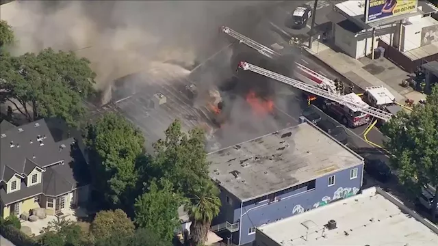 Roof collapses to a vacant business as San Jose firefighters respond to building fire