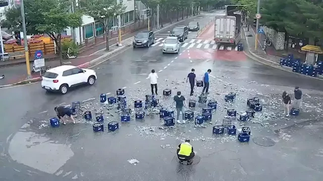 Korean beer company searches for 'real heroes' who cleaned up massive bottle spill