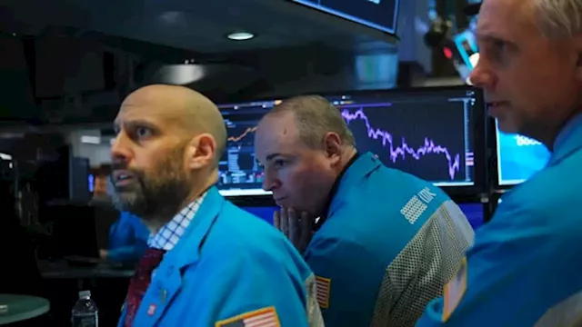 Dow tumbles 700 points into bear market territory, sets a new low for the year