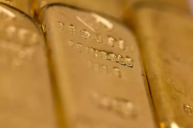 Business Maverick: Gold Tops $1,900 for First Time Since May After US CPI Drops