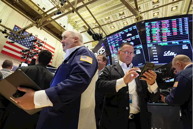 Stocks waver after inflation data surprise, Fed minutes: Stock market news today