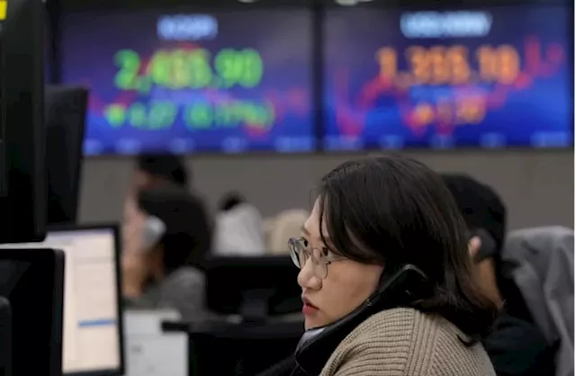 Stock market today: World markets edge lower as China reports slower growth in the last quarter