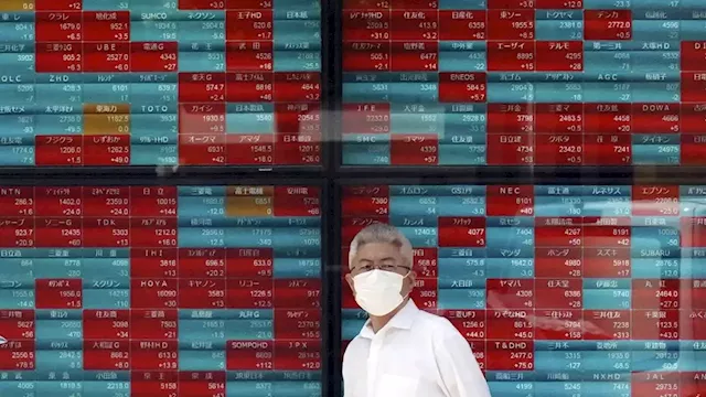 Stock market today: Asian shares mixed as Japan business confidence rises and US shutdown is averted