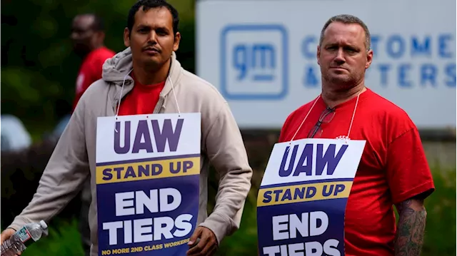 Head of auto workers union says strikes will continue in drive to gain better offers from companies