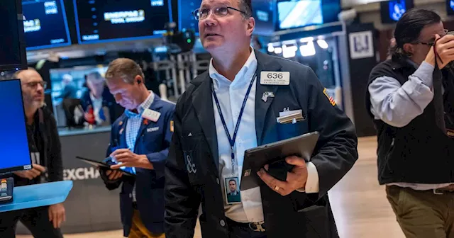 Global stocks edge higher as investors await earnings reports