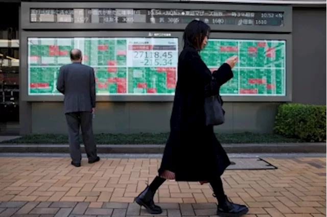 Japanese shares climb to highest level since 1990 on strong earnings