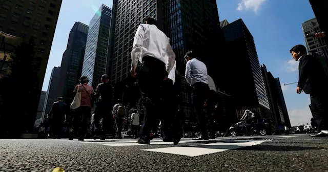 Japan business mood improves, but global stress dims outlook