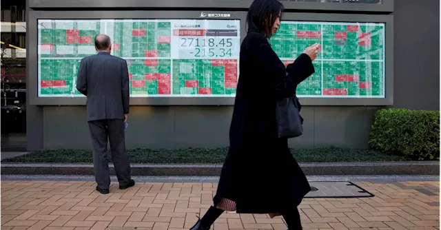 Asian shares mixed, gold spikes as market awaits economic data