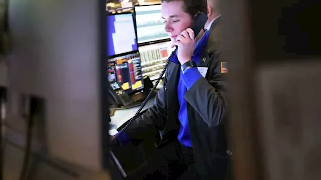 Stock futures slide to start week with more earnings and a Powell speech ahead