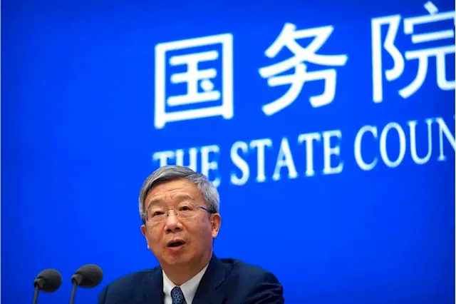 China unexpectedly retains central bank chief, finance minister