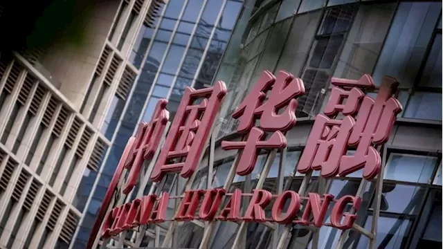 China Huarong swings to annual loss as core business weakens