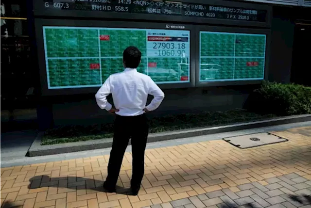 Asian stocks tumble after hawkish Powell comments