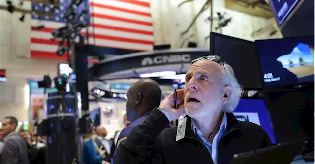 Wall St slips on mixed earnings, Fed's rate path in focus