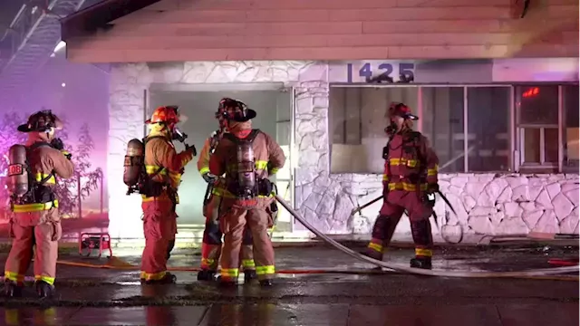 Flames shoot out of 2nd floor windows while crews try to get inside West Side business