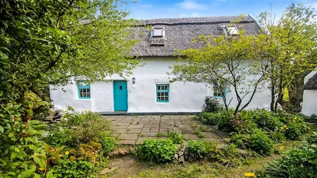 Nestled in the foothills Wicklow Mountains, this traditional thatched cottage is on the market for €380,000 | IMAGE.ie