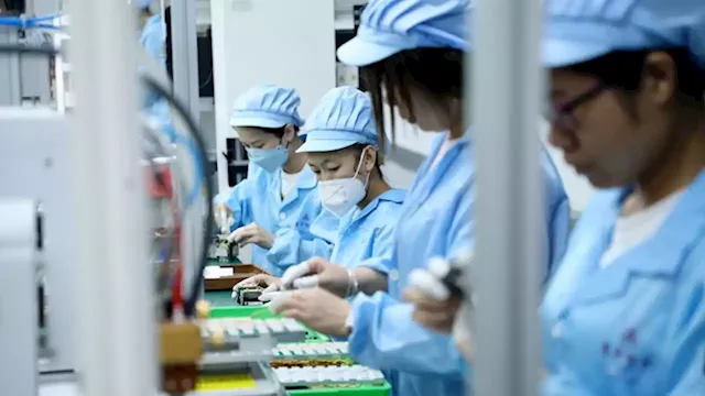 China's economic recovery loses steam as factory production contracts further | CNN Business