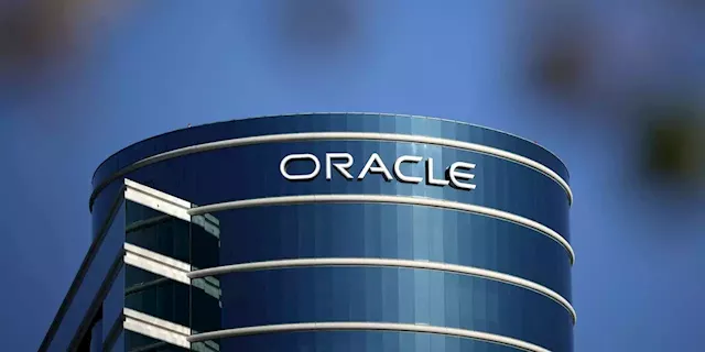 Oracle stock rises on upbeat outlook, while Apple shares slip and other stocks on the move