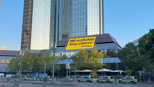 Greenpeace activists climb Deutsche Bank HQ in climate protest | CNN Business