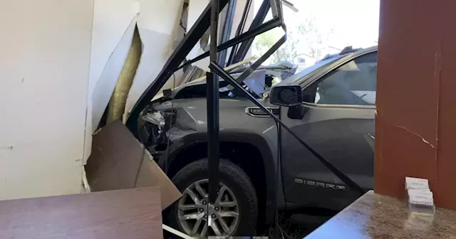 Two employees injured when truck crashes into business in Mesa