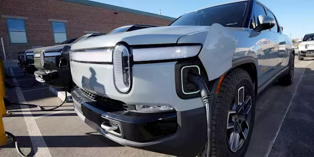 Tesla technology inches closer to becoming industry standard as Rivian joins its charging network