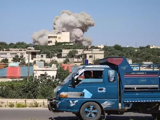 Airstrike hits busy market in opposition-held northwestern Syria and kills at least 9 people