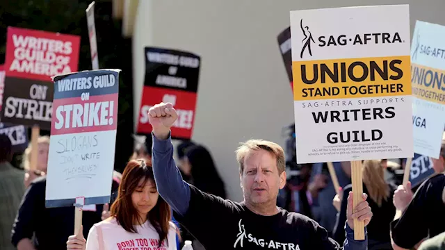 Hollywood actors join screenwriters in historic industry-stopping strike as contract talks collapse