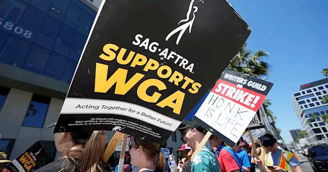 Hollywood actors join screenwriters in historic, industry-stopping strike