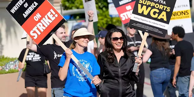 Hollywood actors join screenwriters in historic industry-stopping strike as contract talks collapse