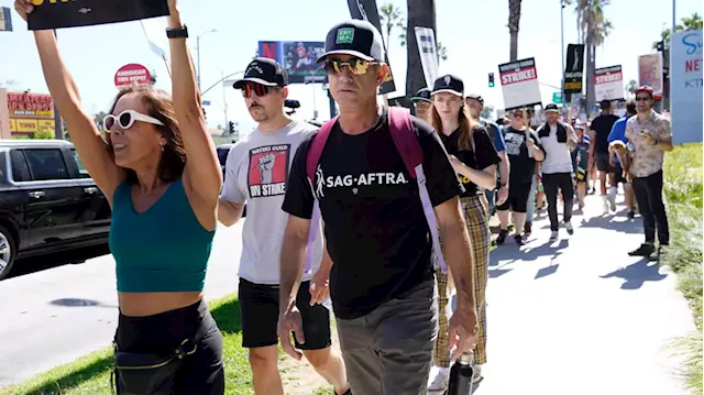 Big name Hollywood celebrities join picket lines in fight over the future business