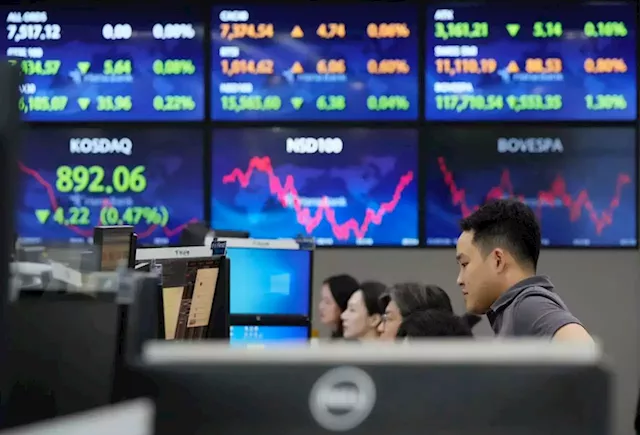 Asian stocks up, US futures slip on Netflix, Tesla results